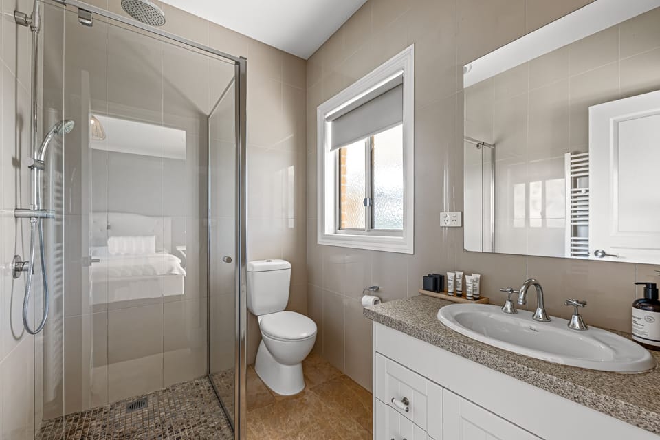 Farmhouse master bedroom with king bed and en-suite