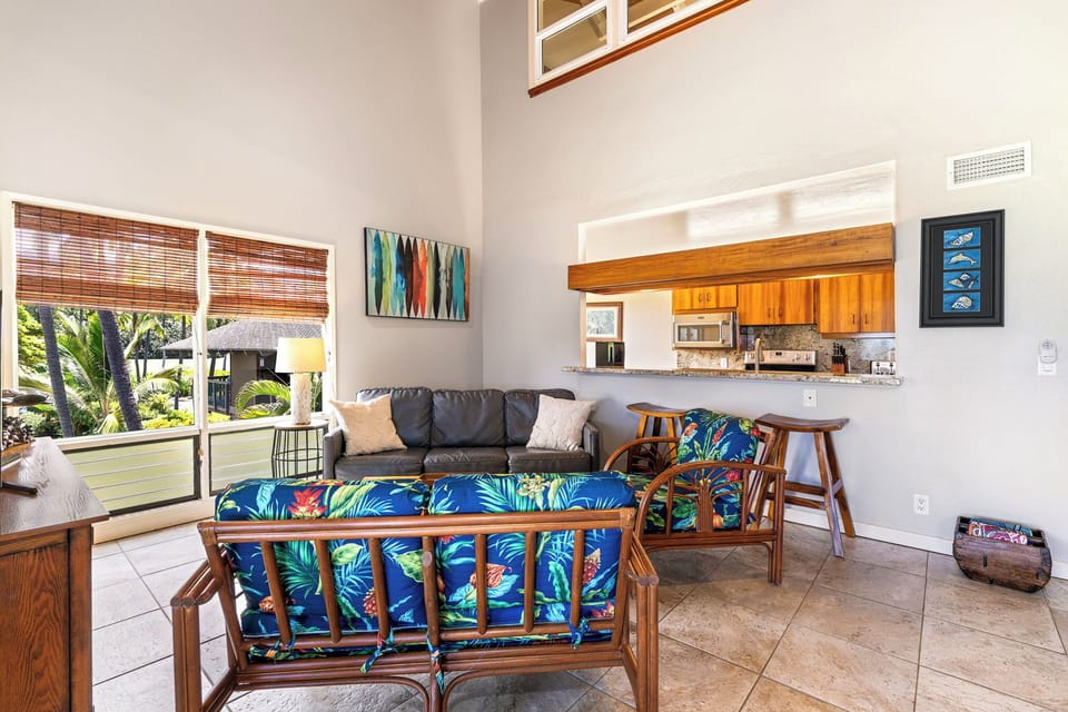 Kick back where the seating area flows into the breakfast bar without a wall in the way.