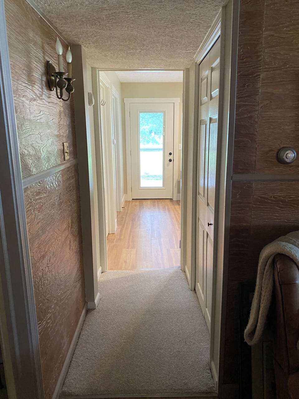 View into main floor (primary) bedroom from living room
