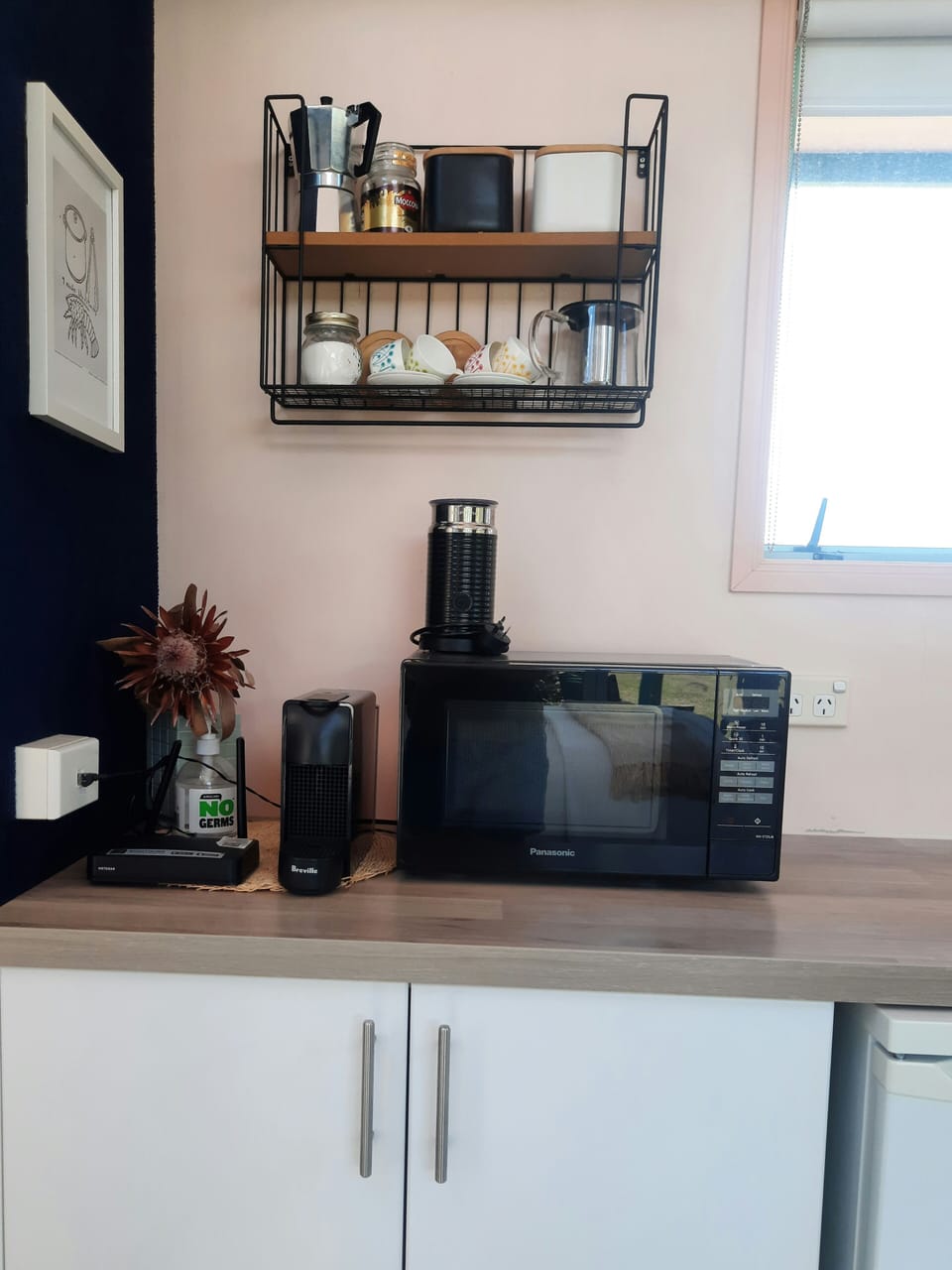 Nespresso, microwave, espresso coffee maker, and teapot ready for your use.