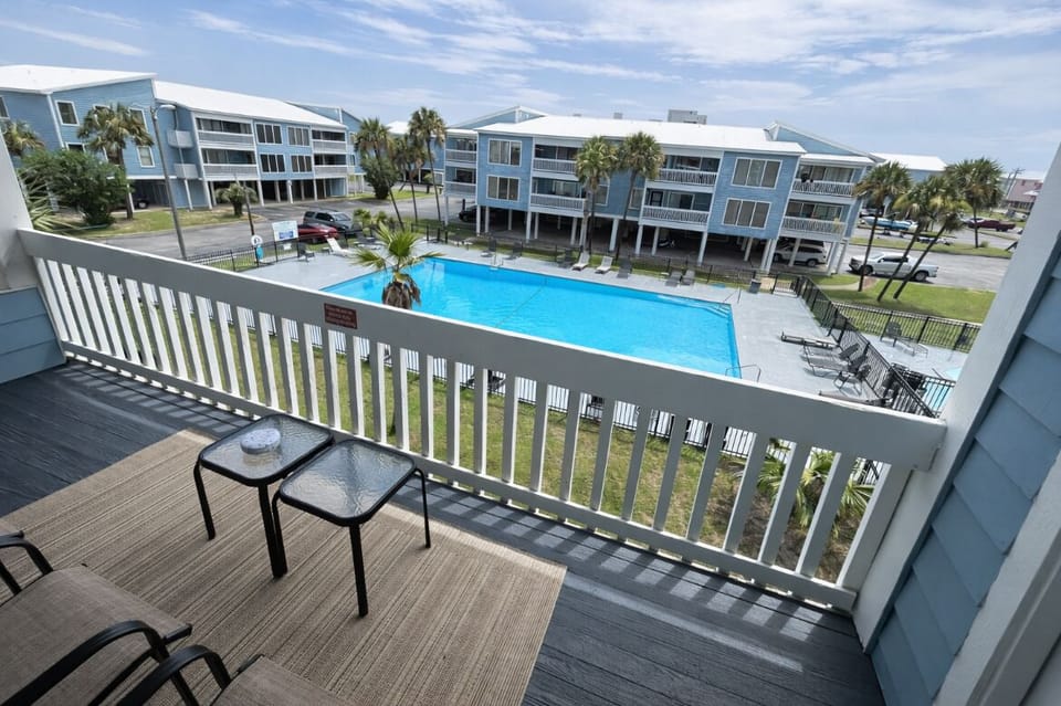 Start your day with morning coffee on the balcony overlooking the pool.