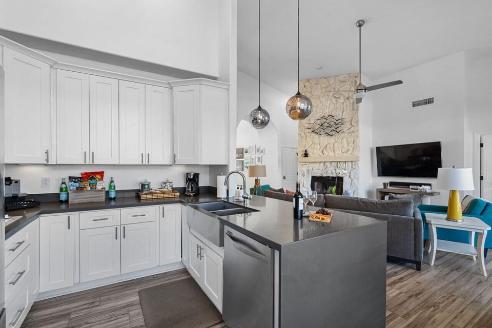 Open kitchen means meal prep doesn`t mean you`re cut off from the rest of the fun!