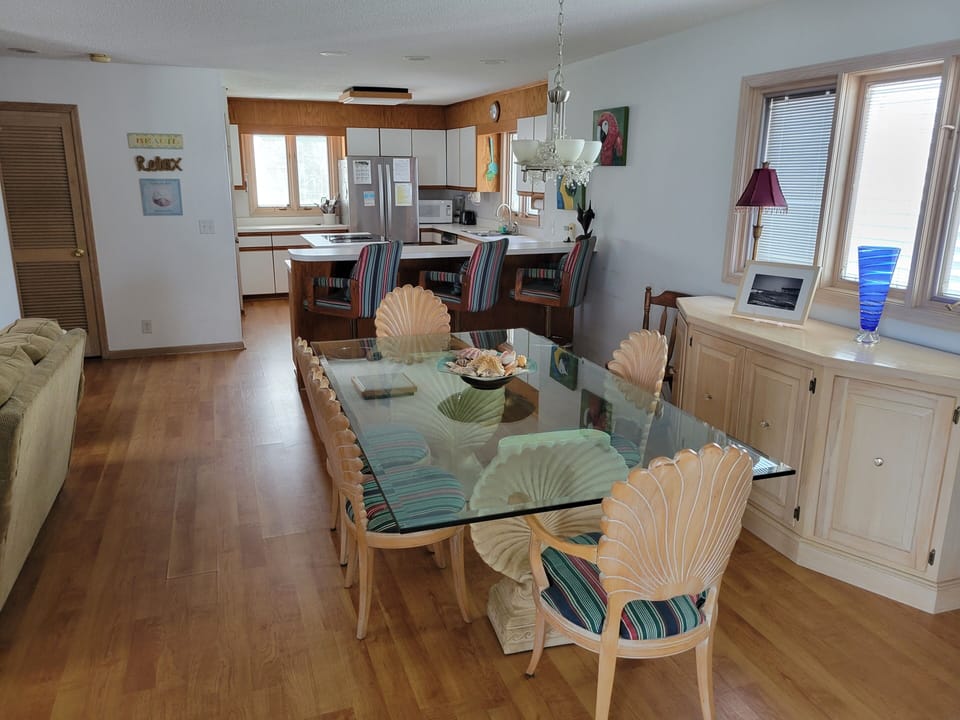 Dining room spanning into kitchen (view from Carolina room)