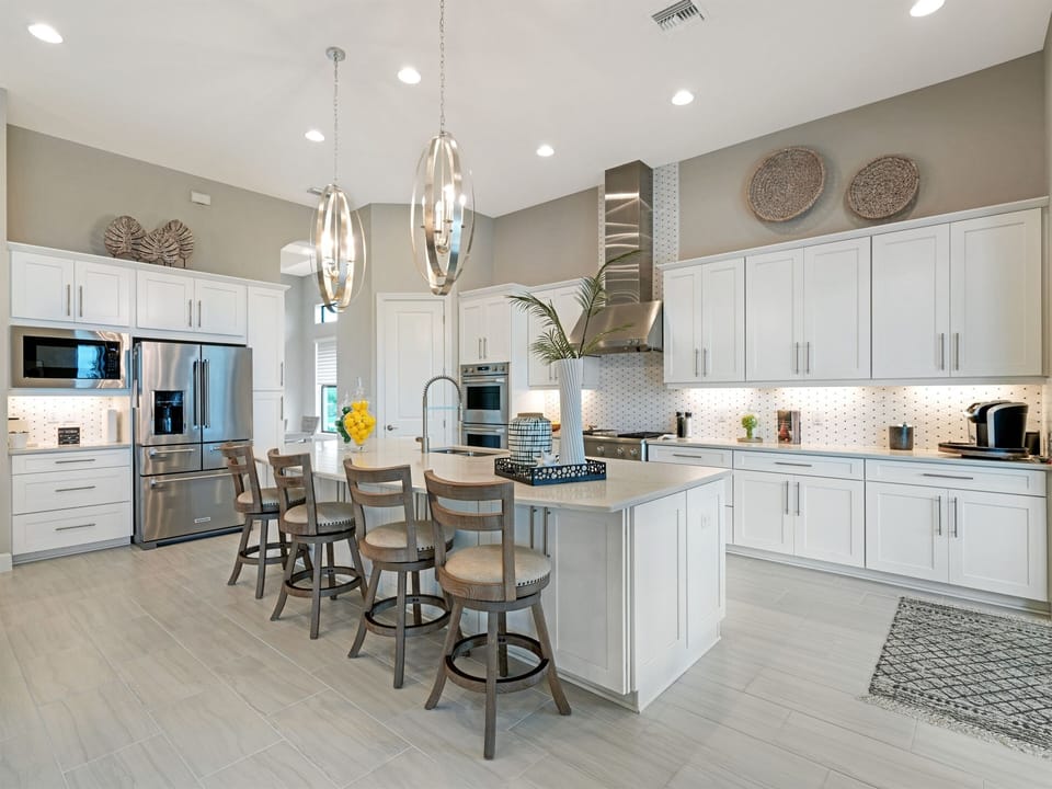 Fully Equipped Kitchen w/ GE Monogram Appliances, 5 Burner Gas Stove Top w/Griddle, Dual Ovens, Large Center Island with Seating for 4 ppl.
