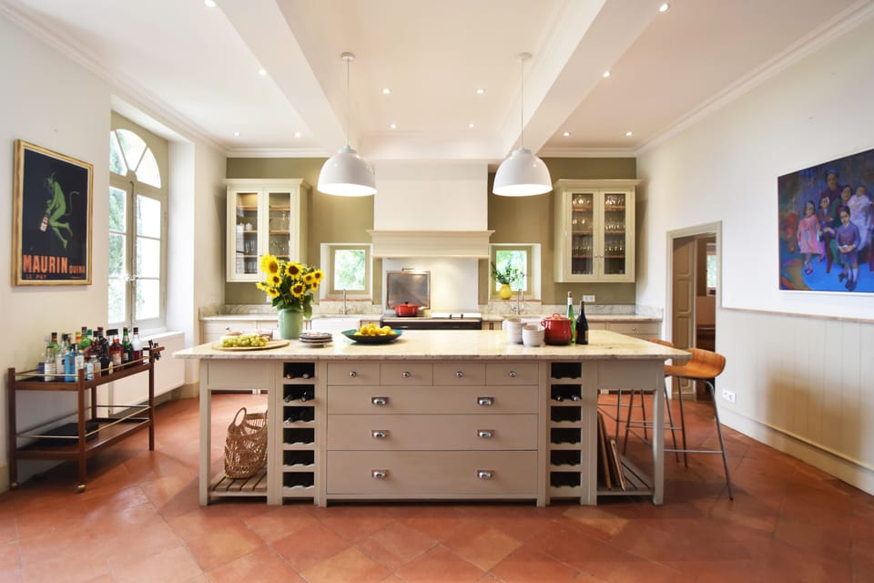 The kitchen has 2 dishwashers, a top of the range Everhot range & a table for 8