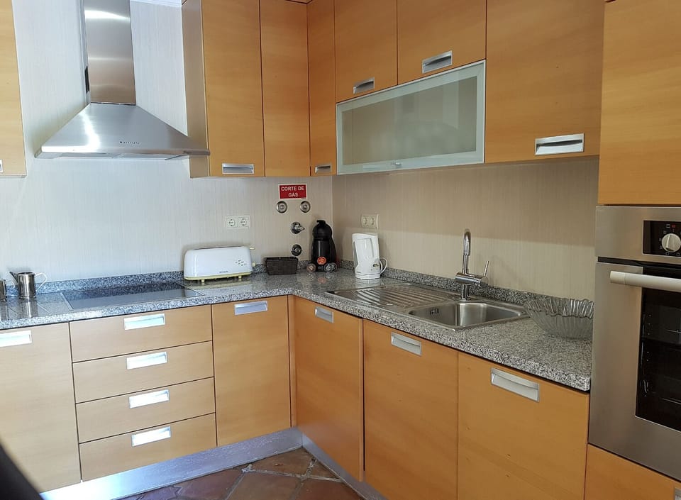 The separate kitchen opens to the patio