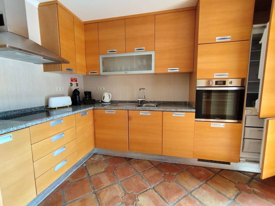 The separate kitchen off the lounge has a door to the pool patio