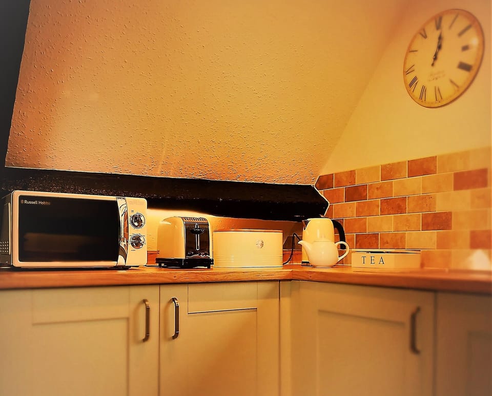 Fully equipped kitchen with modern appliances.