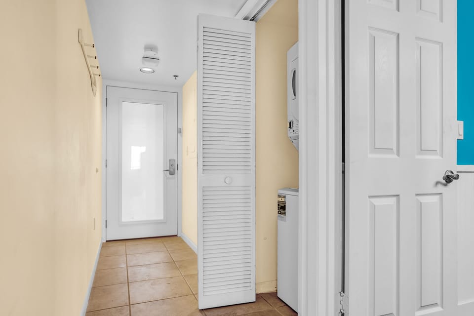 Entry hallway with guest bedroom, washer/dryer closet and guest bathroom