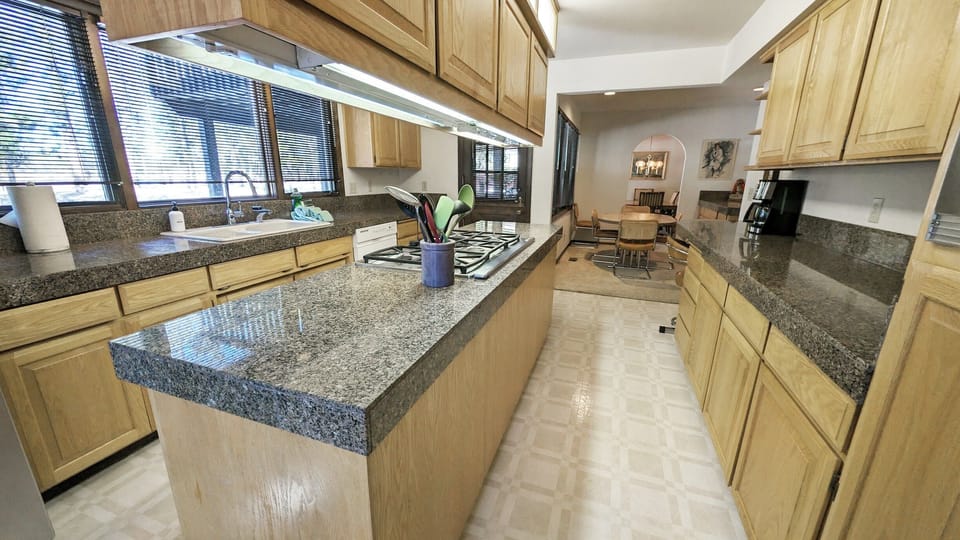 Double Galley Kitchen looking at the Nook. A Dutch Door leads to the deck