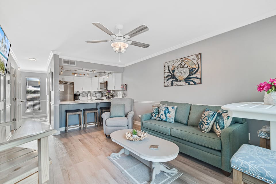 Designed for modern comfort, this condo features an open living and kitchen area, perfect for socializing and shared experiences.