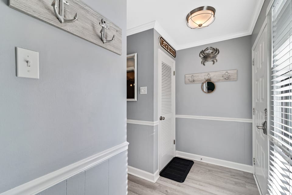 Step into comfort. This inviting entryway sets a welcoming tone with thoughtful coastal-inspired accents and practical storage solutions.