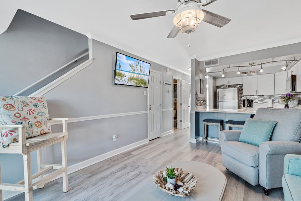 Enjoy seamless living and entertaining in this open-concept layout, connecting the comfortable living area with a well-appointed kitchen.