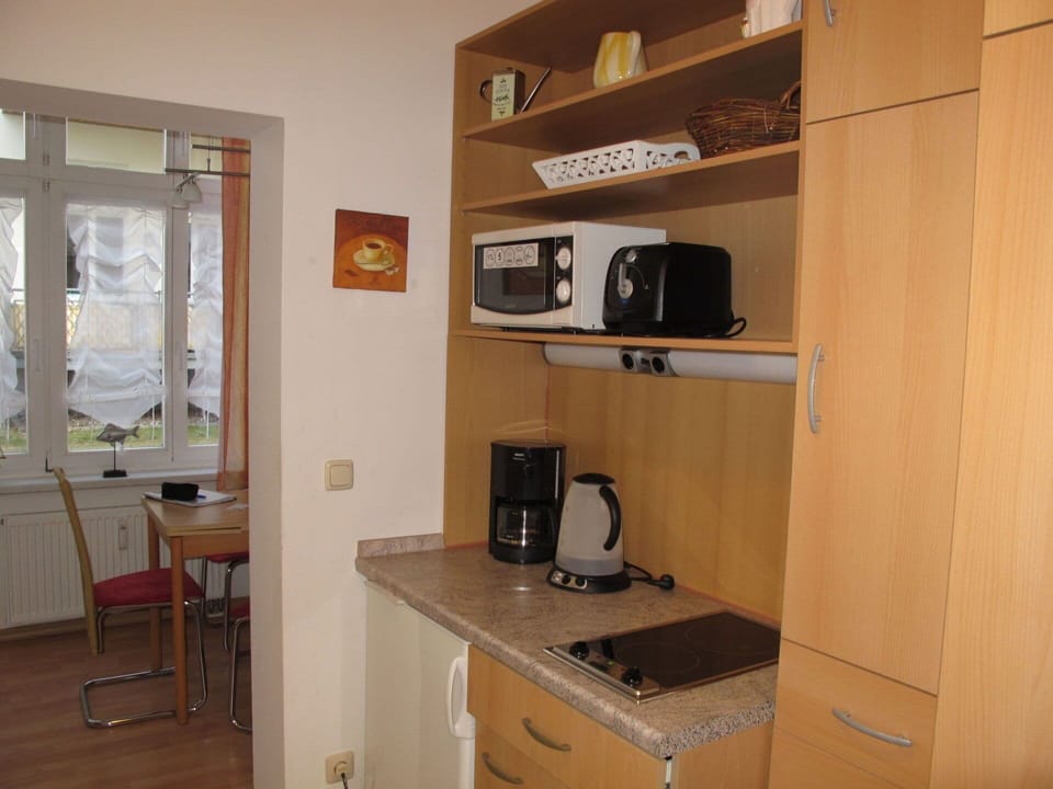 Furniture, Cabinetry, Building, Wood, Home Appliance, Kitchen Appliance, Television, Interior Design, Drawer, Window