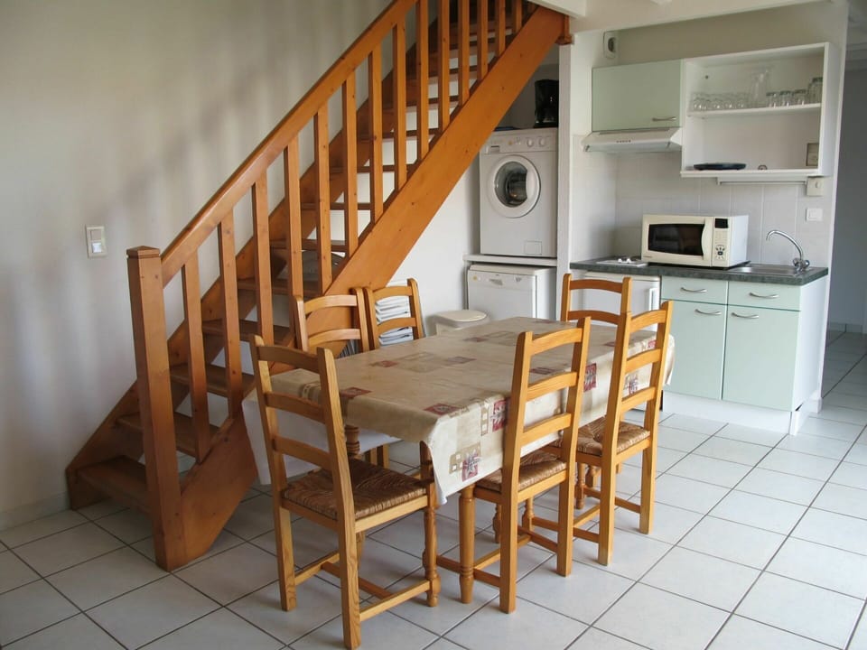 Cabinetry, Furniture, Countertop, Chair, Wood, Kitchen Appliance, Kitchen Stove, Flooring, Interior Design, Floor