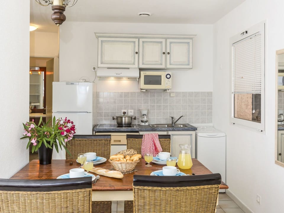 Room, Furniture, Property, Countertop, Kitchen, Interior Design, Yellow, Building, Ceiling, Cabinetry