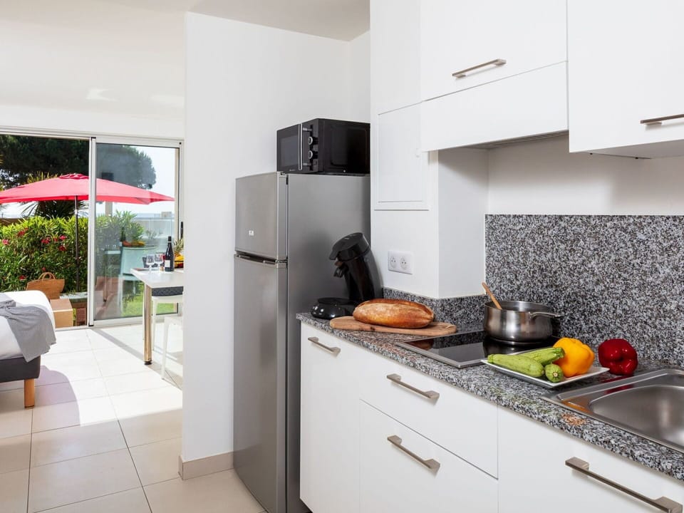 Cabinetry, Kitchen Stove, Countertop, Kitchen Appliance, Plant, Kitchen, Gas Stove, Wood, Home Appliance, Flooring