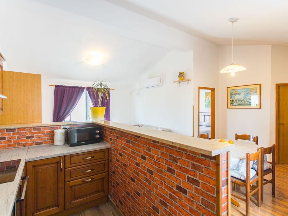 Furniture, Cabinetry, Countertop, Wood, Building, Flooring, Wood Stain, Floor, Drawer, Wall