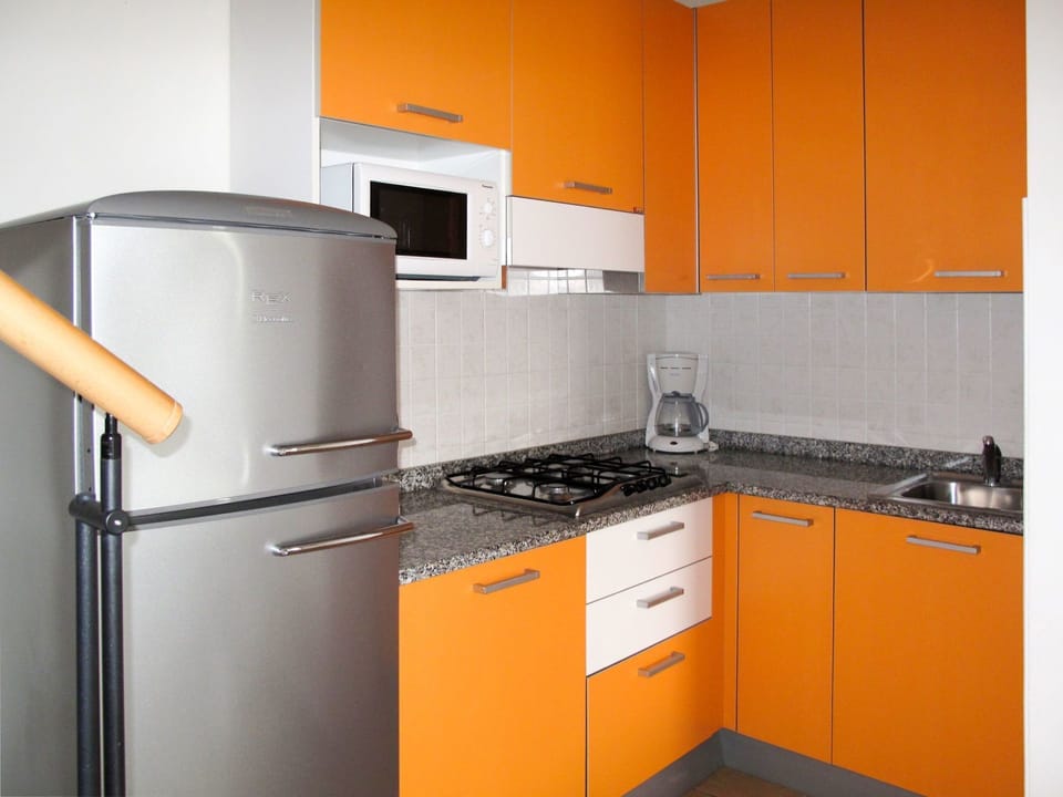 Orange, Kitchen, Cabinetry, Room, Yellow, Property, Countertop, Major Appliance, Furniture, Kitchen Appliance