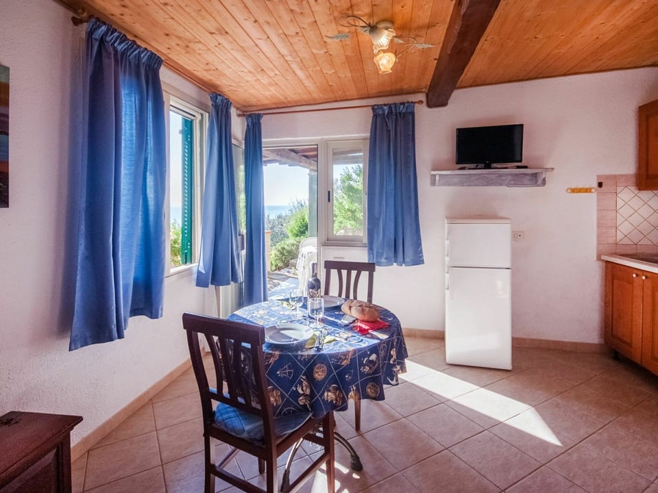 Table, Furniture, Property, Cabinetry, Blue, Chair, Building, Wood, Kitchen Appliance, Lighting