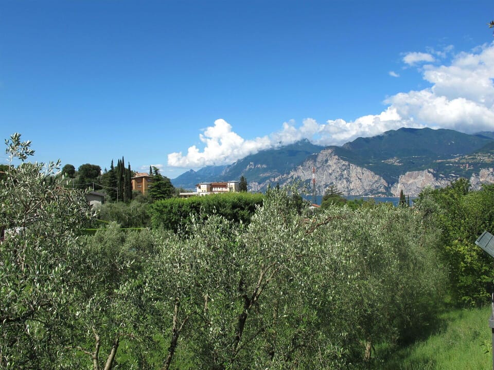 Sky, Cloud, Plant, Mountain, Natural Environment, Natural Landscape, Vegetation, Land Lot, Highland, Tree