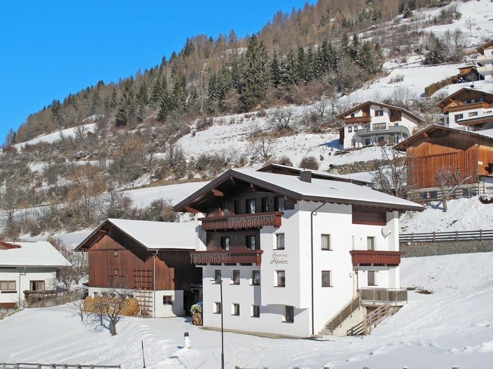 Mountain, Sky, Snow, Property, Building, Window, Tree, Slope, House, Biome