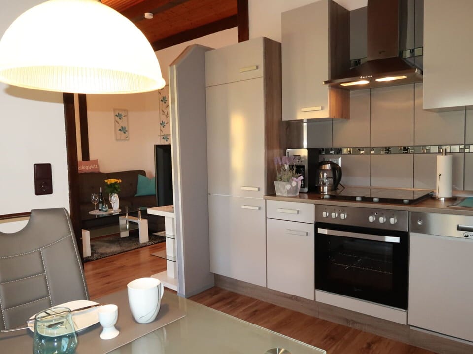 Property, Cabinetry, Furniture, Countertop, Wood, Kitchen Stove, Interior Design, Tap, Lighting, Plumbing Fixture