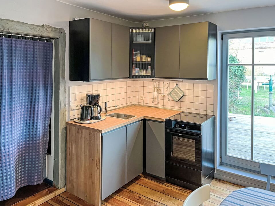 Cabinetry, Countertop, Property, Building, Window, Wood, Kitchen, Interior Design, Kitchen Stove, Flooring