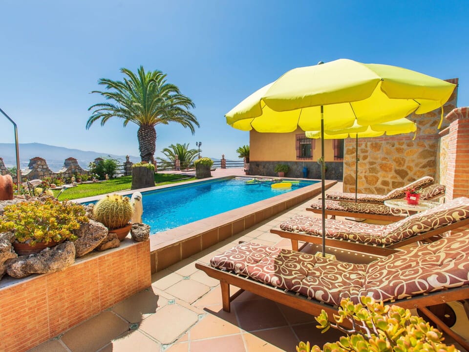 Water, Plant, Building, Property, Sky, Swimming Pool, Nature, Azure, Shade, Umbrella