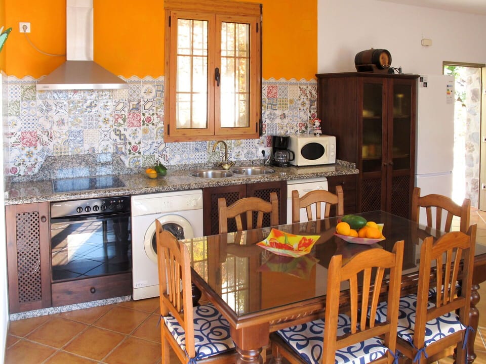 Countertop, Window, Kitchen, Cabinetry, Wood, Kitchen Appliance, Kitchen Stove, Interior Design, Building, Home Appliance