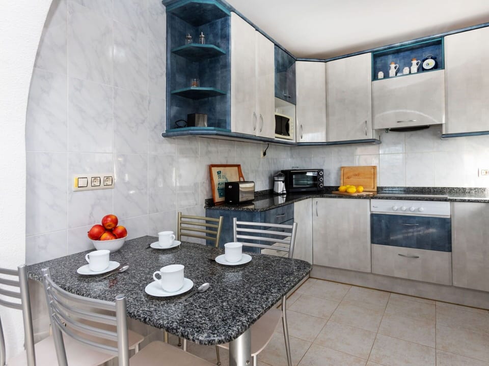 Furniture, Property, Table, Cabinetry, Countertop, Interior Design, Kitchen, Architecture, Wood, Exhaust Hood