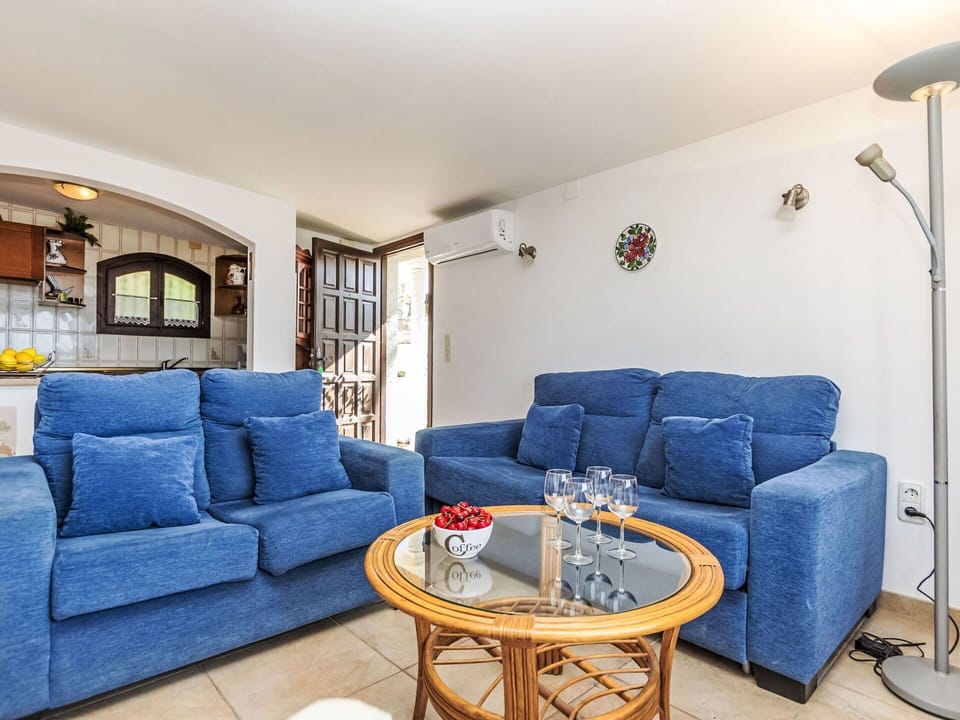 Couch, Furniture, Table, Property, Azure, Lighting, Picture Frame, Interior Design, Houseplant, Living Room