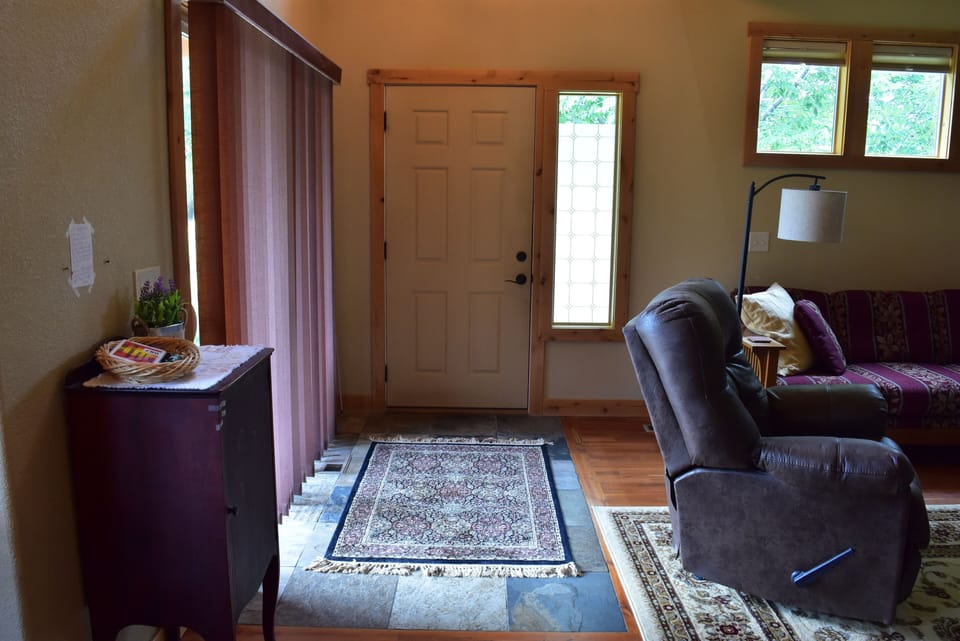 Entry Door with Living Room to the right.