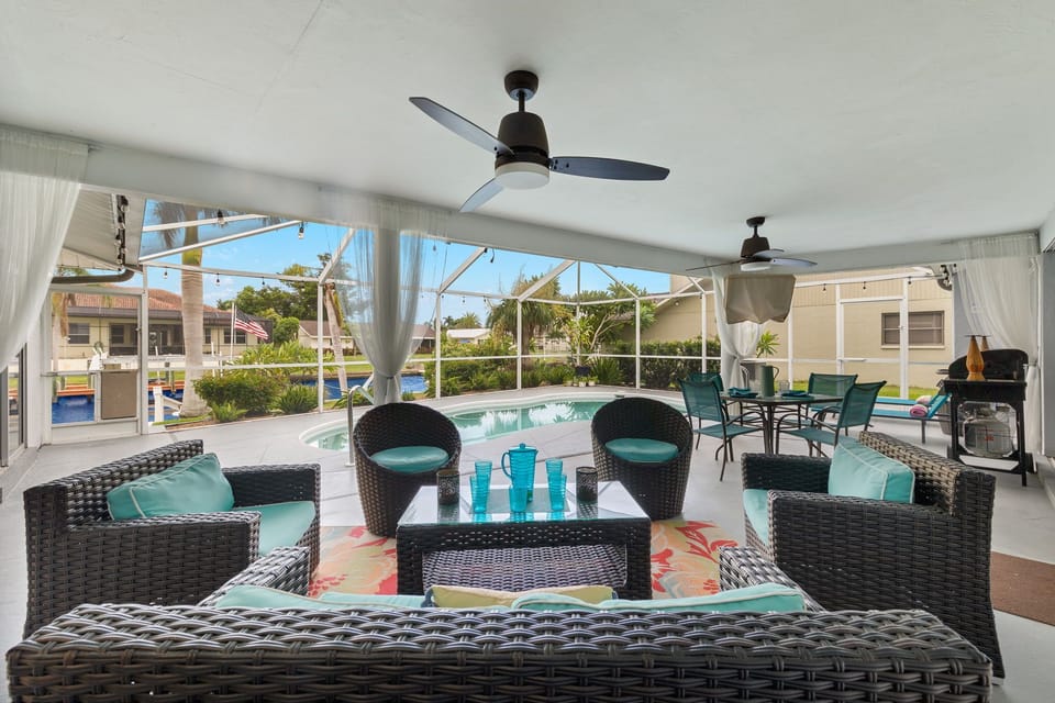 There is plenty of seating & a flat-screen TV by the pool