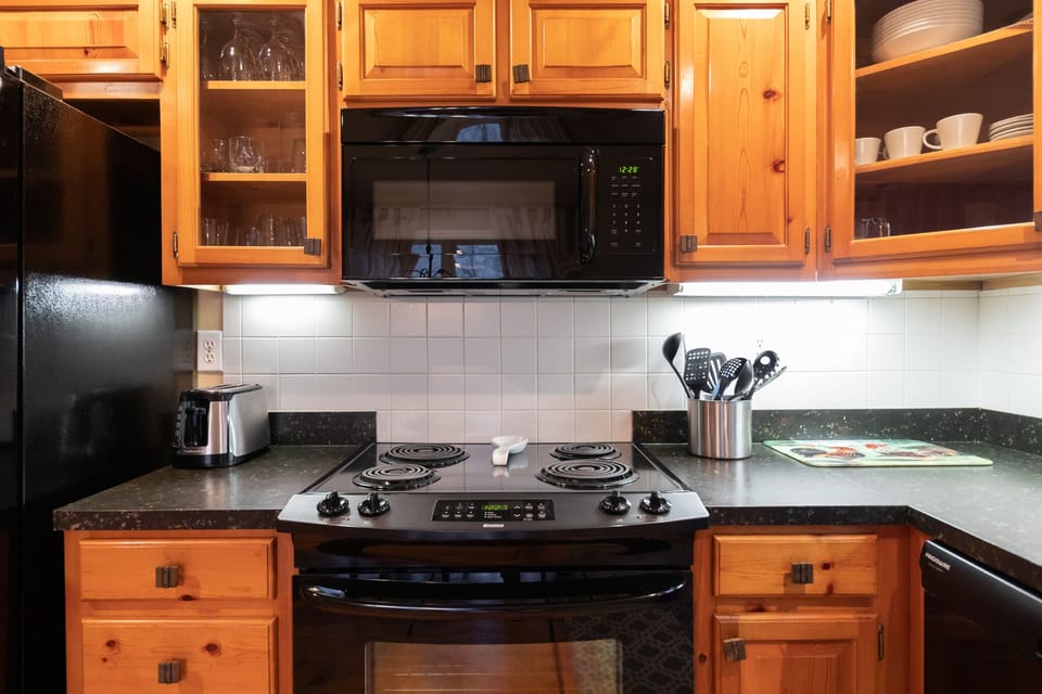 Electric stove, microwave, dishwasher, plates, silverware & all cooking utensils