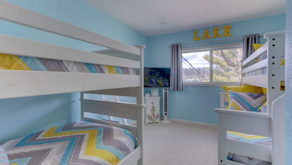 The Family Suite with a half bath & a lake view. Top bunks are for kids only!