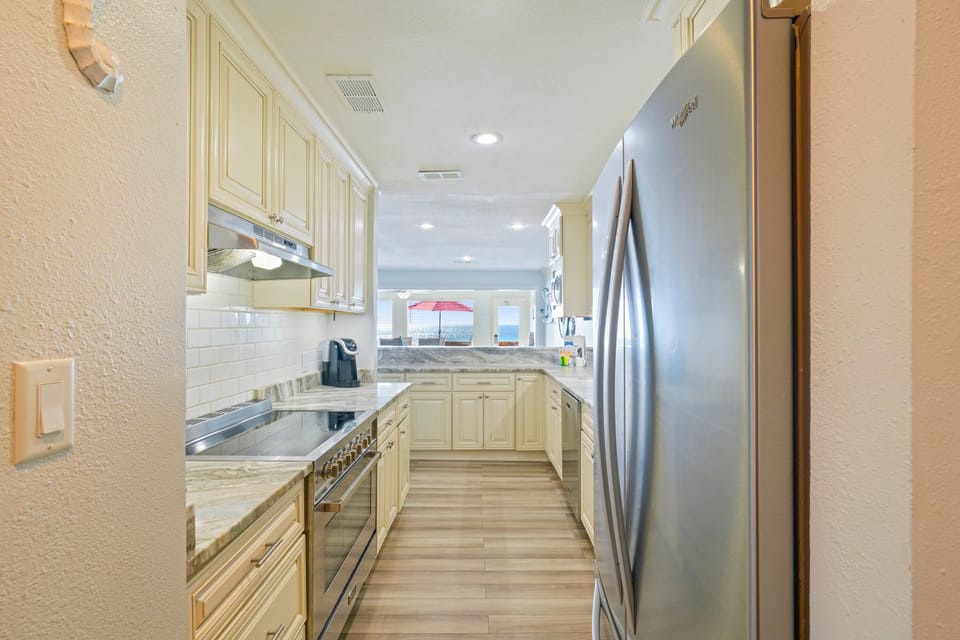 This beautifully updated kitchen makes gathering effortless, whether you are packing beach snacks, blending smoothies, or cooking a fresh seafood dinner.
