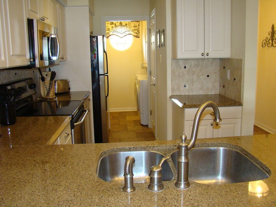 Kitchen with attached laundry room.