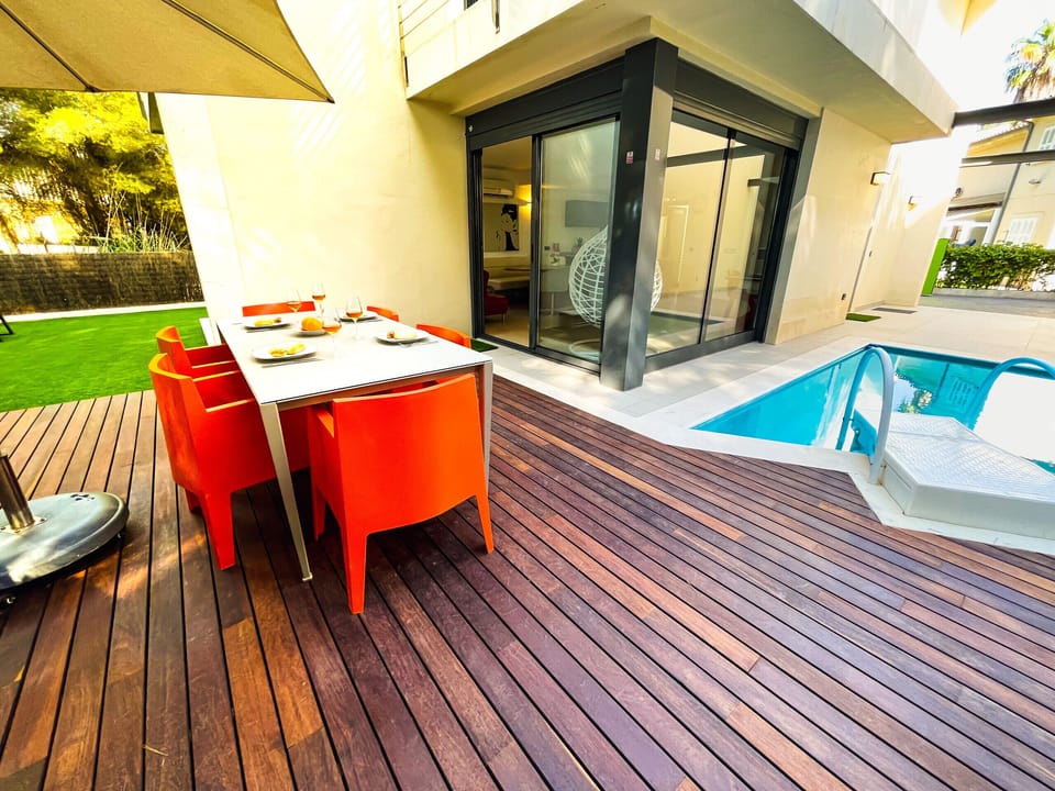 This is the large terrace of the holiday home in Mallorca. There are a lot of useful things to relax here, like a pool.