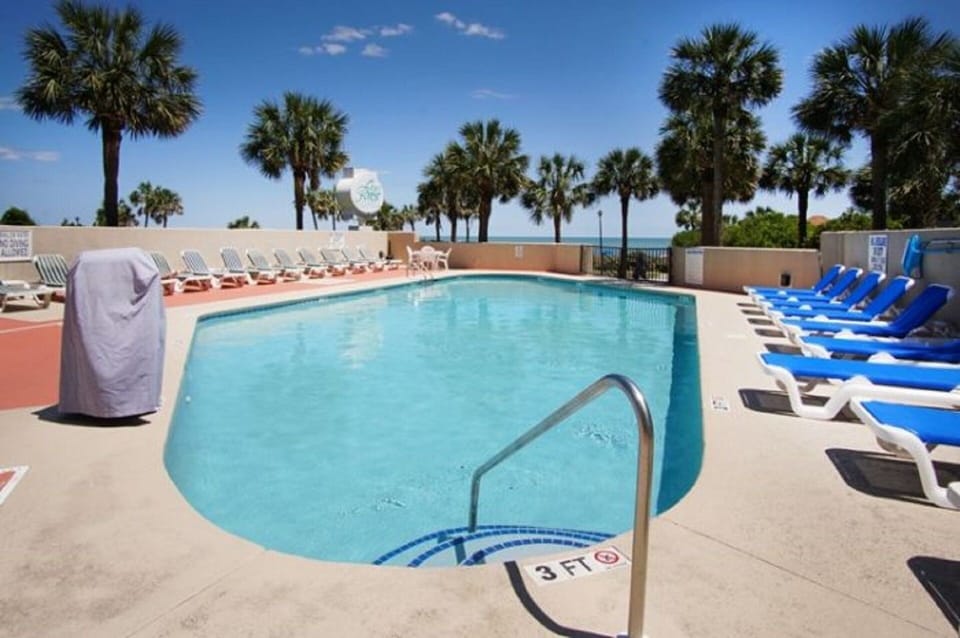 Relax poolside or hop in for a swim under clear blue skies.