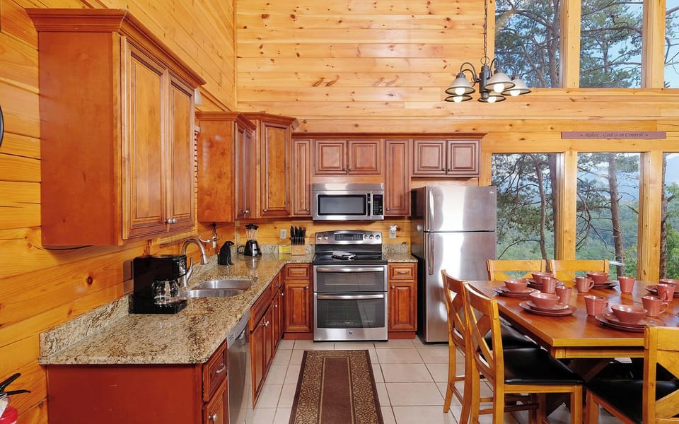 Fully-Equipped Kitchen with Dining Table and Large Windows