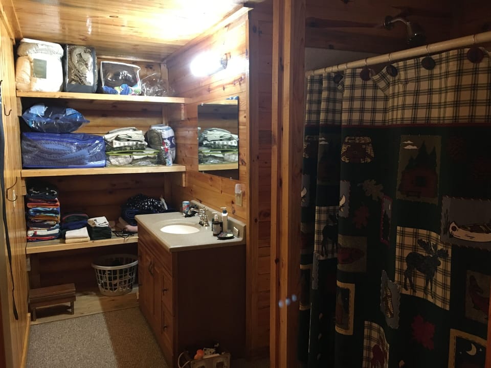 Bathroom 1: shower, toilet, sink, extra linens, towels & washcloths
