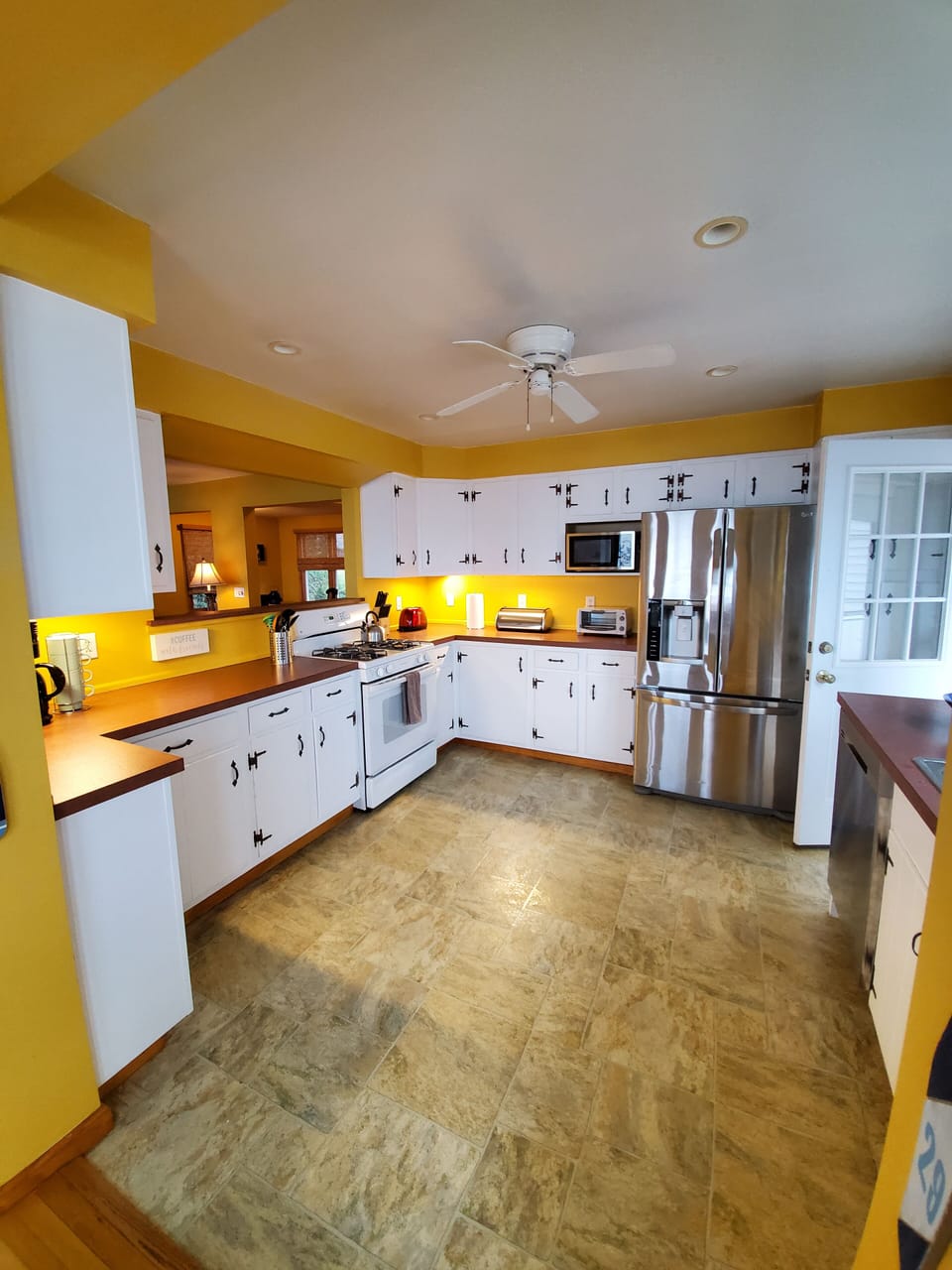 Large kitchen, lots of cabinets and cooking space. Fully stocked 