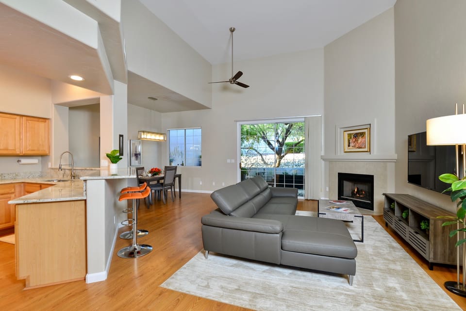 Entering the home from the foyer. LR with 65" HDTV, kitchen and DR to left.