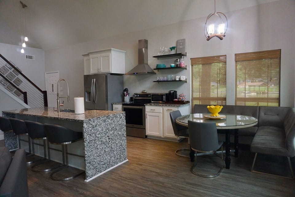 Nook with banquette seating and glass tabletop