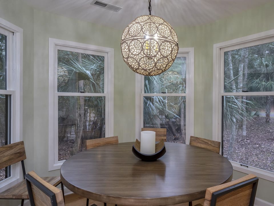 Dining room seating for 8 with beautiful windows and views