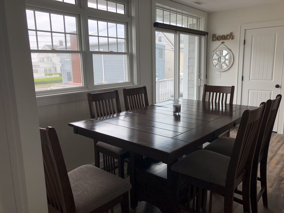 High top dining table directly out to the front deck with ocean views
