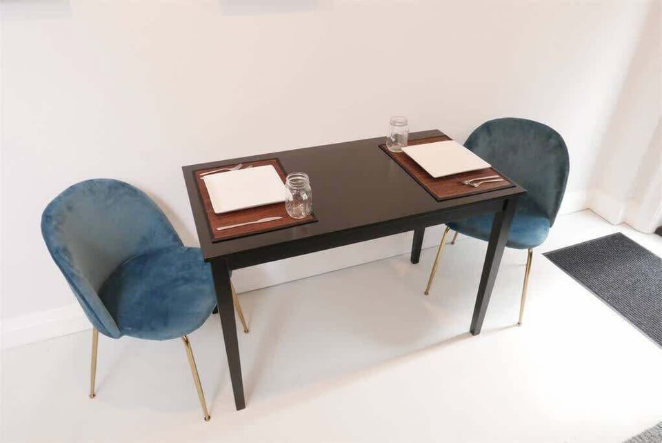 Dining room table doubles as a laptop friendly work space!