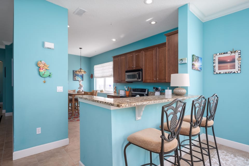 Additional seating at the kitchen counter.