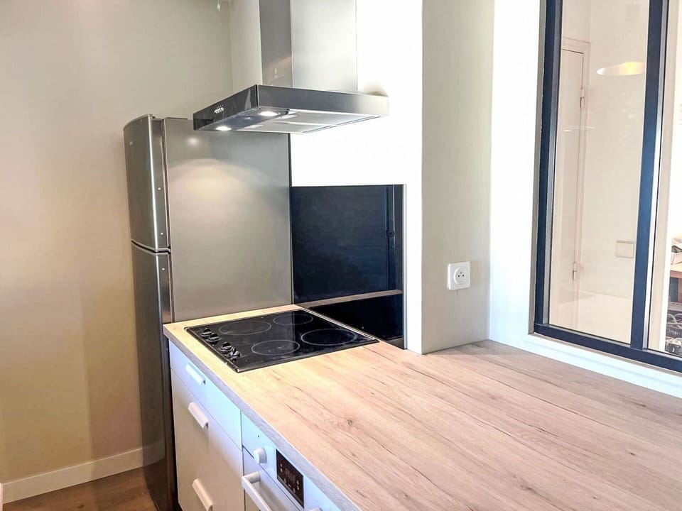 Flooring, Interior Design, Wood, Kitchen Appliance, Countertop, Major Appliance, Kitchen, Floor, Furniture, Cabinetry